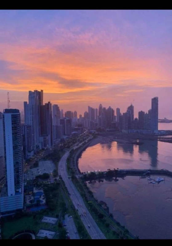 Balcony with city skyline and Pacific ocean views at PH White Tower Panama City