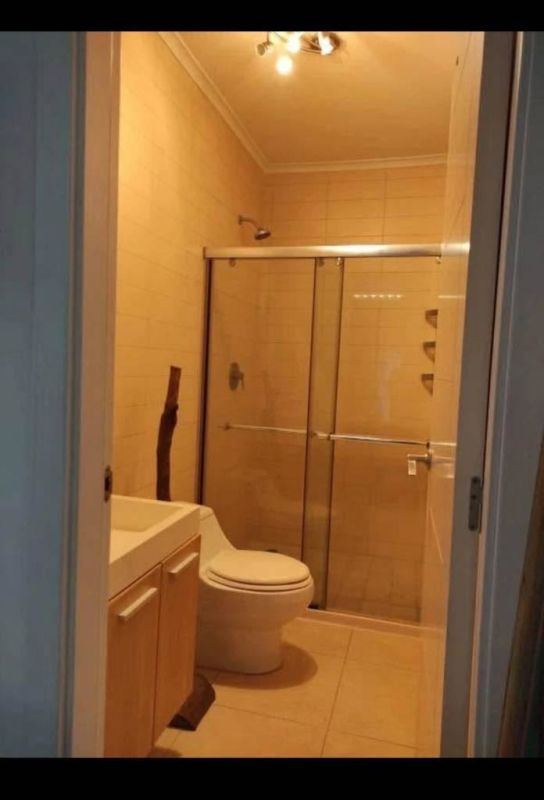 Contemporary bathroom with glass-enclosed shower and vanity PH White Tower Panama