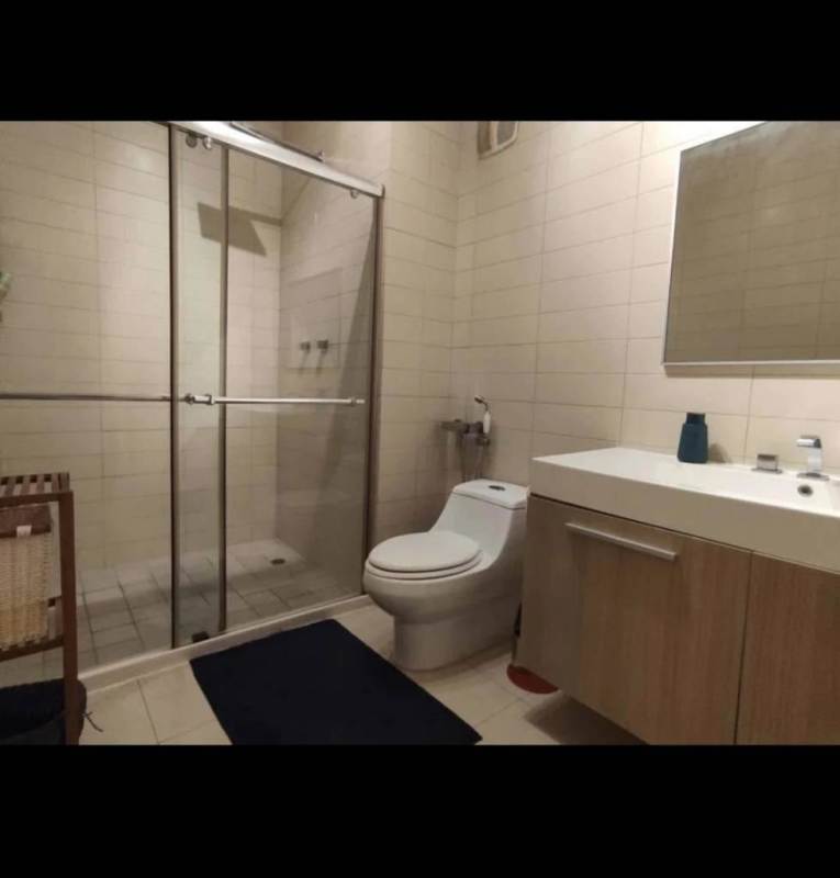 Bathroom featuring vanity, glass shower enclosure PH White Tower Panama City apartment