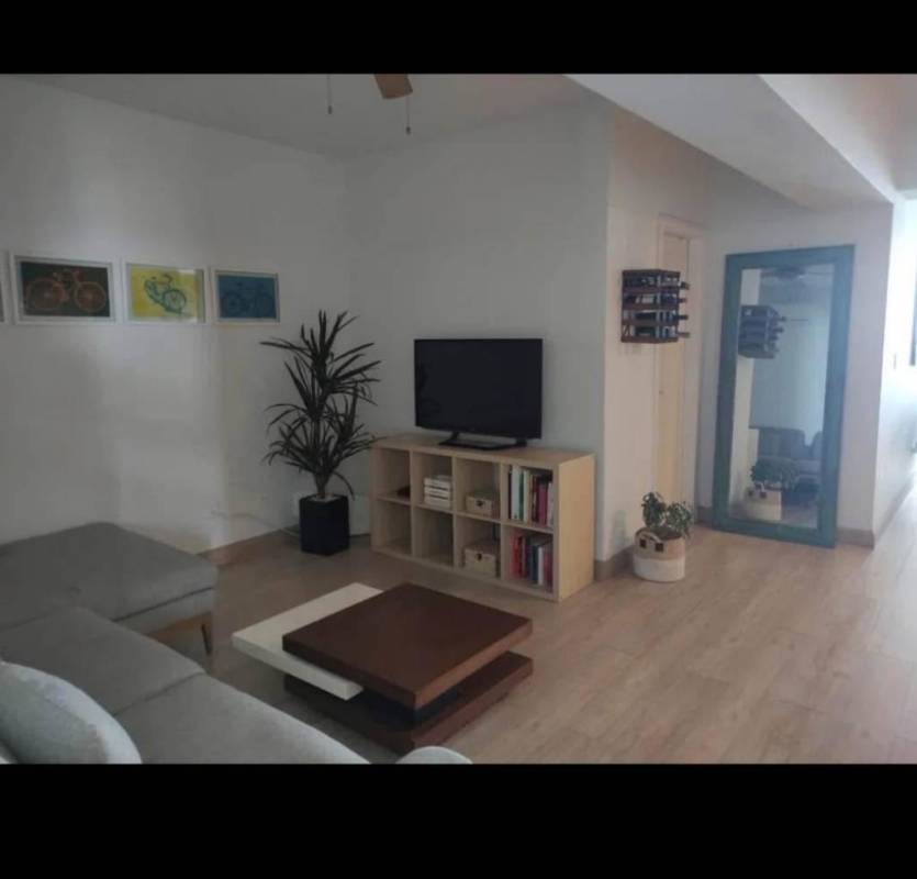 Living room with modern decor, plenty of sunlight and ocean view at PH White Tower Panama