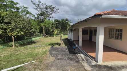 Entrance of country house with covered porch in gated community Capira Sajalices Panama
