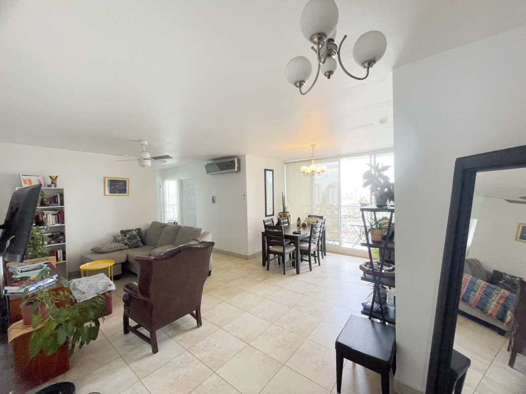 Contemporary living and dining space with bright windows in PH Portofino Panama