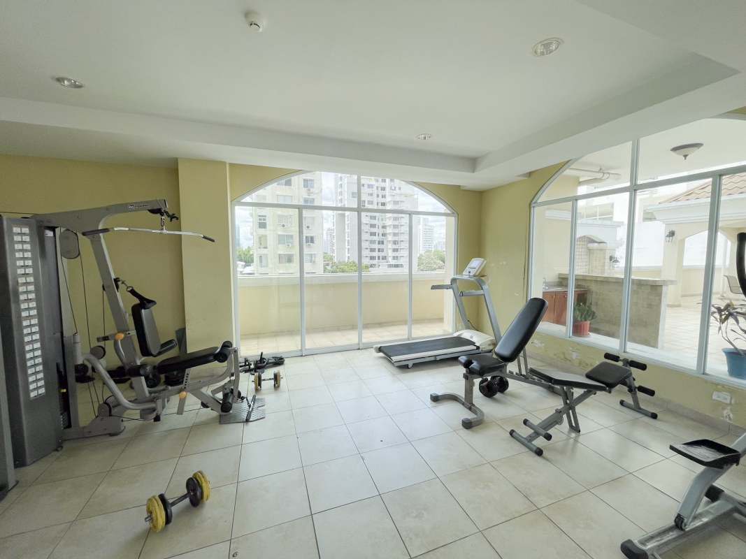 Apartment complex swimming pool and jacuzzi overlooking city at PH Portofino Panama