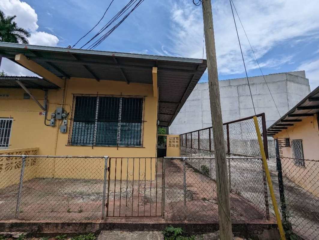 House rental kitchen with granite countertop, dark wood cabinets in Betania Panama