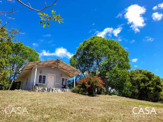 Small white cabin with front porch rural Alto Boquete Panama