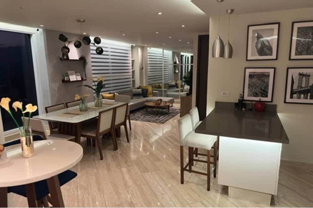 Modern European kitchen with quartz countertops, stainless fridge, pendant lights in Santa Maria Panama