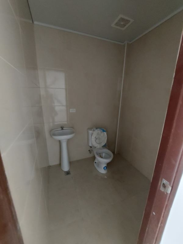 Modern bathroom with tile walls and floor in commercial unit for rent in Panama City