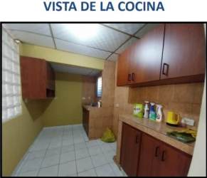 Empty bedroom tiled with pink walls ceiling fan window blinds house Villa del Carmen La Chorrera