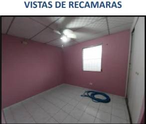 Open living dining area with tile floors ceiling fan arched entry Villa del Carmen La Chorrera