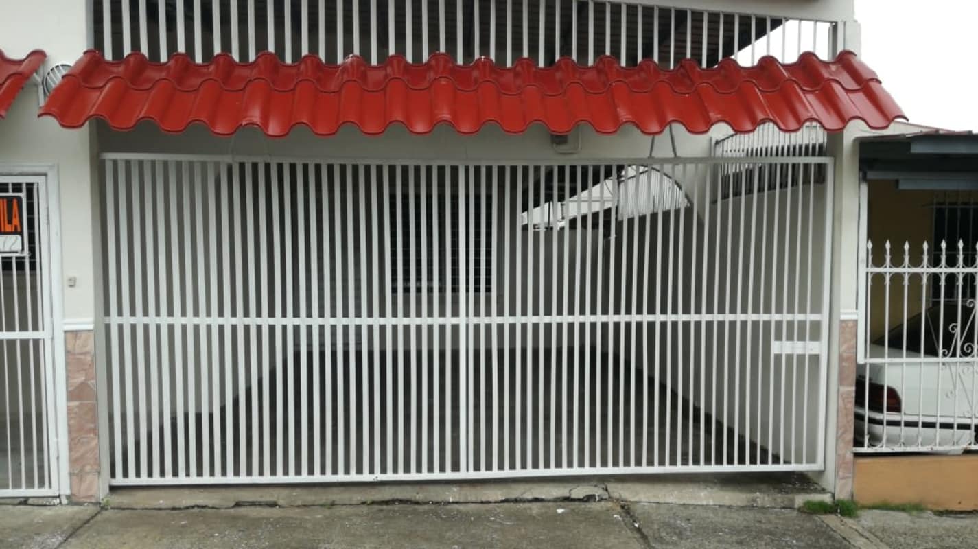 Metal gate and covered parking area affordable house Panama San Miguelito
