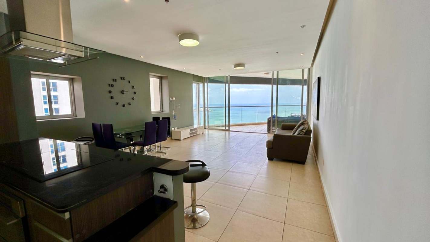 Modern open plan kitchen, dining and living area with ocean view balcony PH BICSA Panama