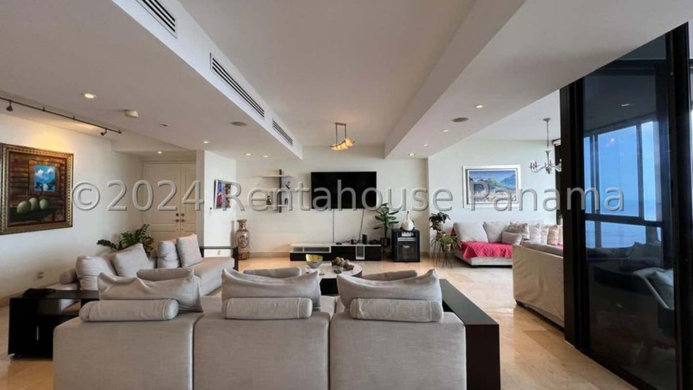 Spacious gourmet kitchen with granite countertops and wood cabinetry in PH Miramar Costa del Este Panama City