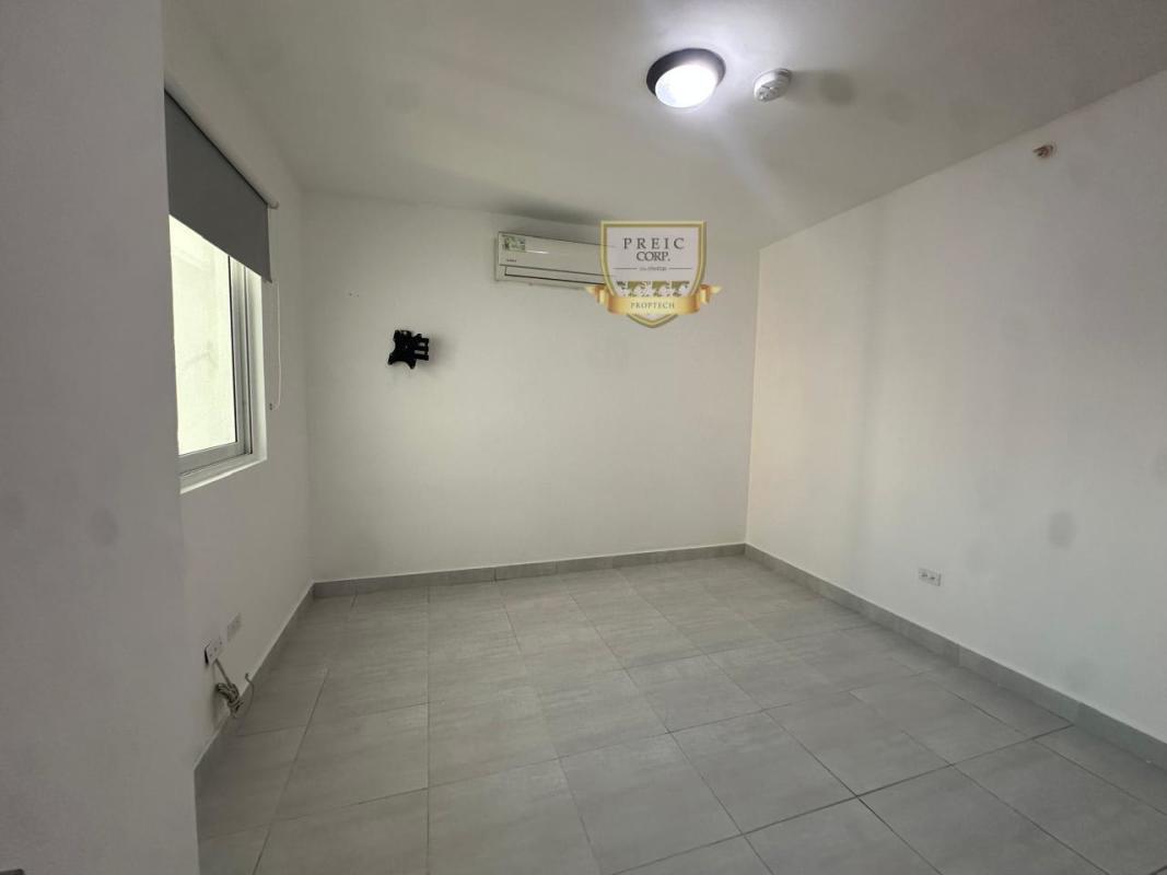 Bedroom with AC-ready wall unit, roller blind at PH Metropolitan Park Panama City