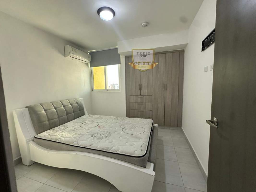 Bedroom with built-in closet and AC unit at PH Metropolitan Park Carrasquilla Panama