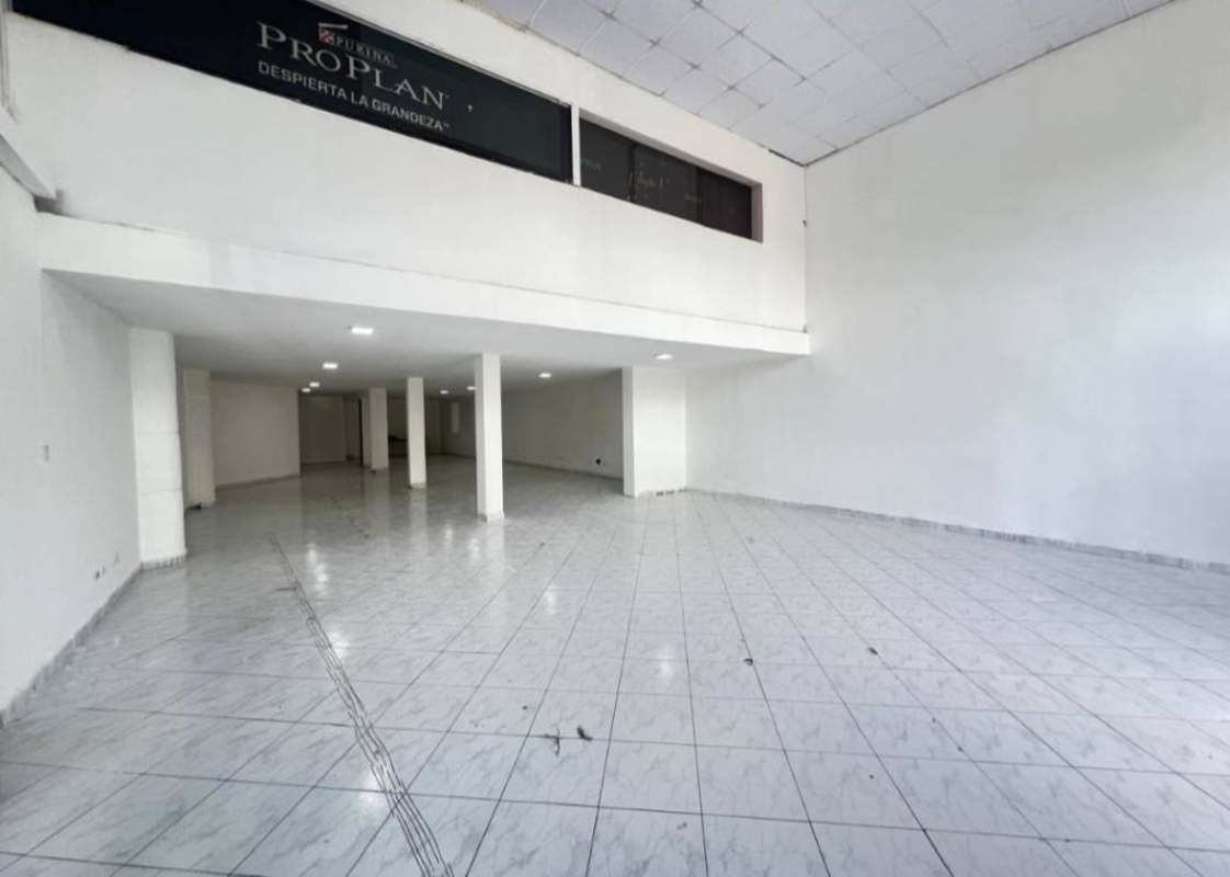 Large empty commercial interior with double-height ceilings enhanced glass front Obarrio Panama