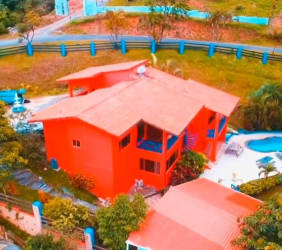 Covered terrace with hammock overlooking tropical mountains in Altos de María Panama