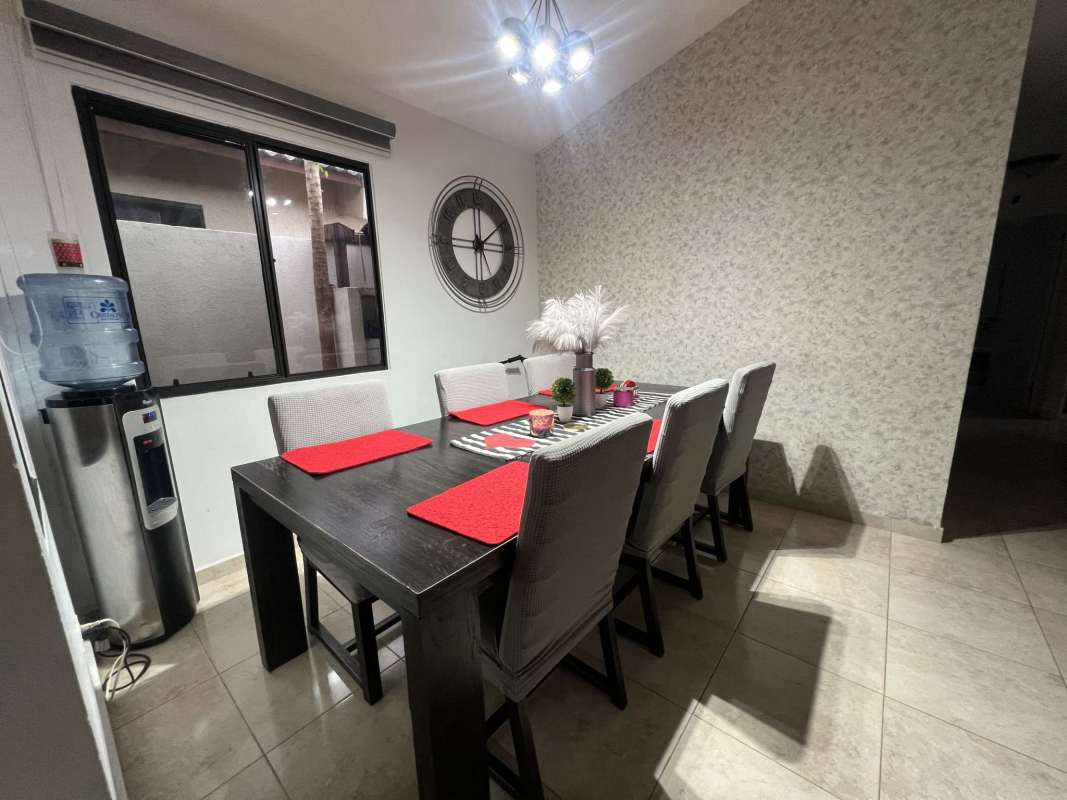 Kitchen with granite countertops, white cabinetry and stainless appliances PH Vistas del Lago Tocumen Panama