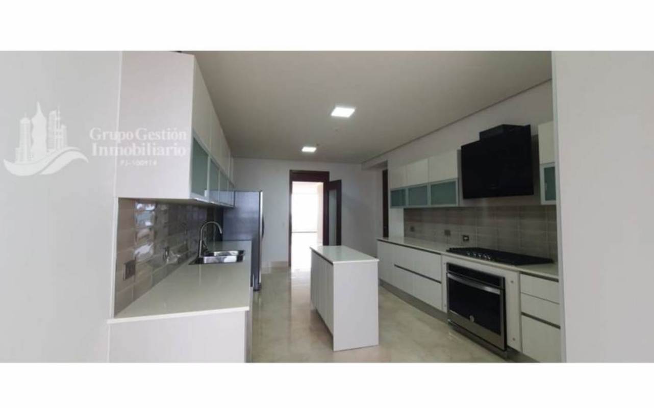 Spacious modern kitchen with island, built-in appliances, cabinets PH Matisse Costa del Este Panama