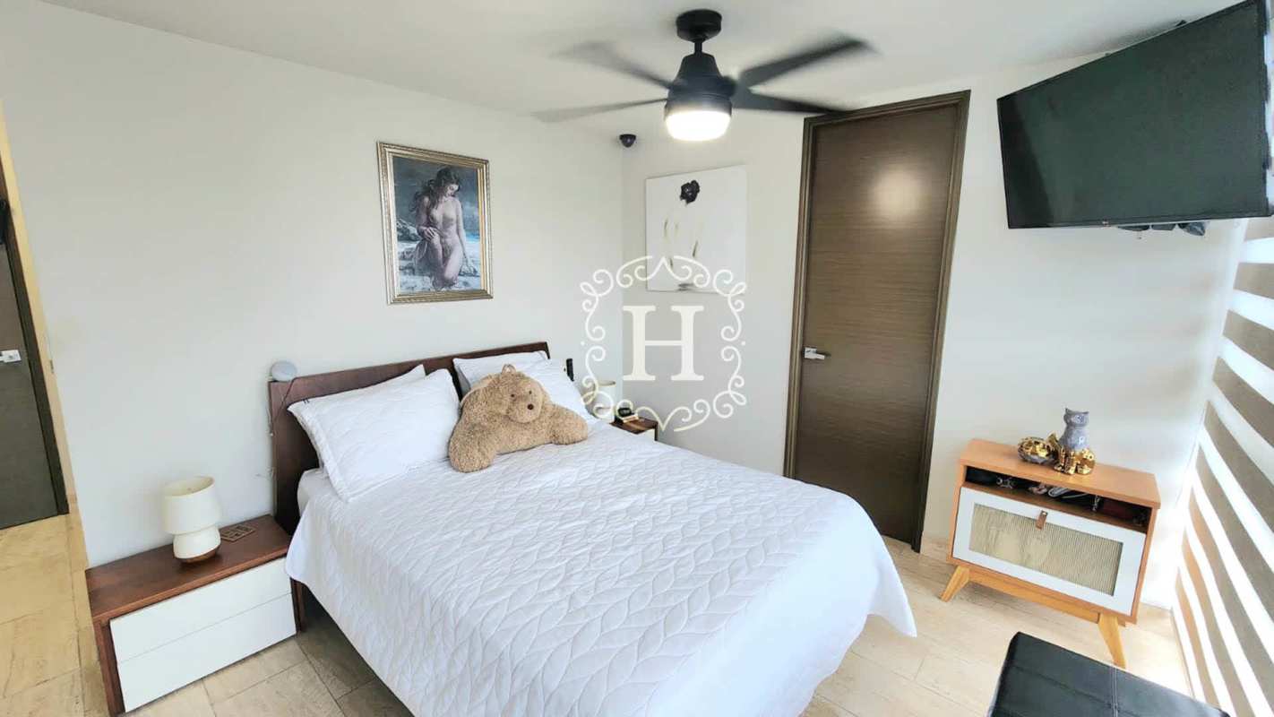 Bright master bedroom with large window and city views PH The Regent Costa del Este