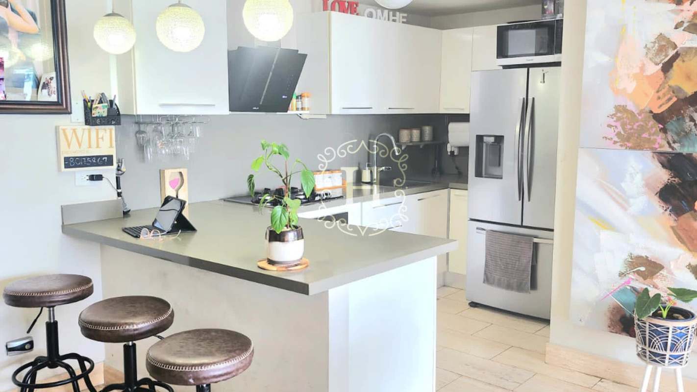 Contemporary kitchen with granite countertops and appliances in PH The Regent Costa del Este Panama