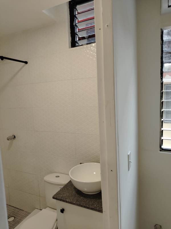 Small bathroom with granite countertop and vessel sink in apartment PH Aurora El Cangrejo Panama