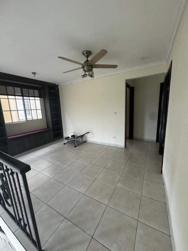 Spacious living room with ceiling fan and large windows Villas Castel Novo Juan Díaz Panama