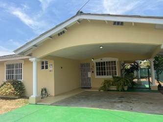 Minimalist style bedroom with bunk bed, single bed, ceiling fan, and window with curtains in Las Tablas Panama