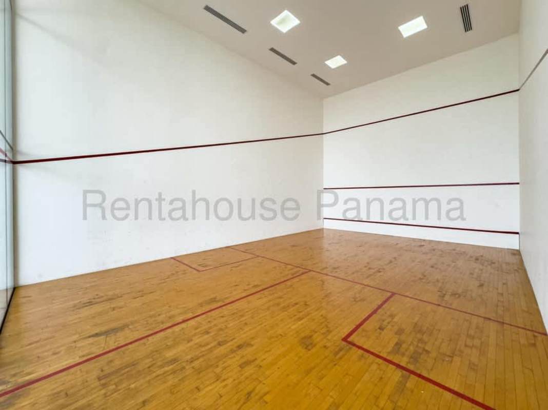 Modern squash court with hardwood floors in luxury condo PH The Towers Panama