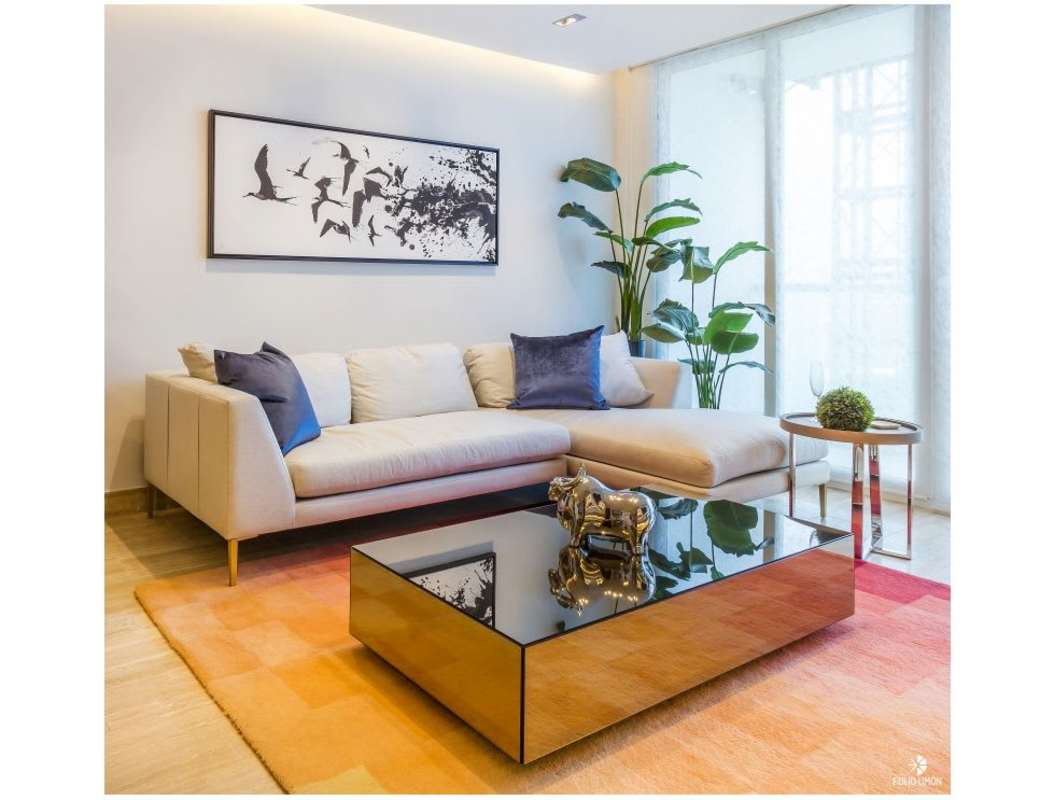 Modern white kitchen with granite counters, bar seating at PH The Regent Costa del Este Panama City