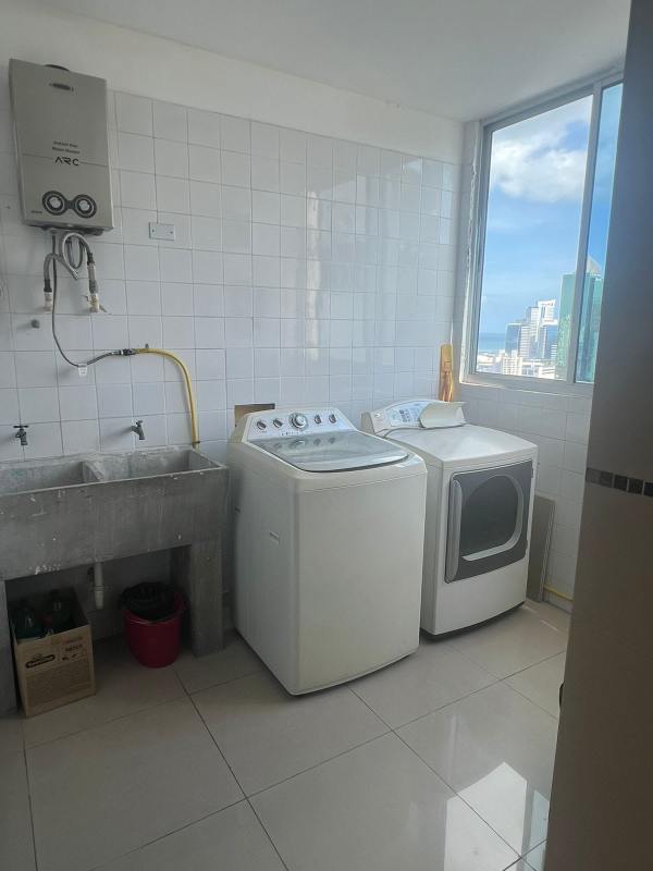 Skyline lap pool surrounded by high-rise towers at PH The Palm Obarrio Panama City