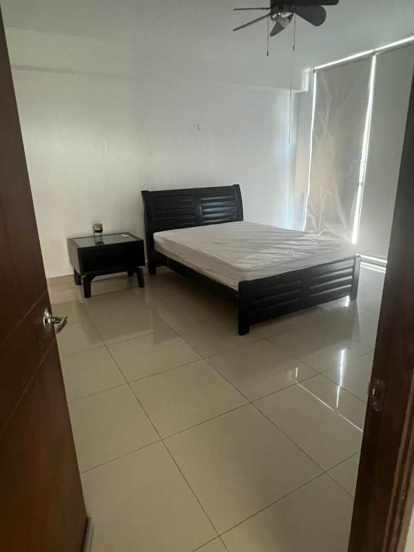 Minimalistic bedroom tiled floor bed and ceiling fan PH The Palm Panama City