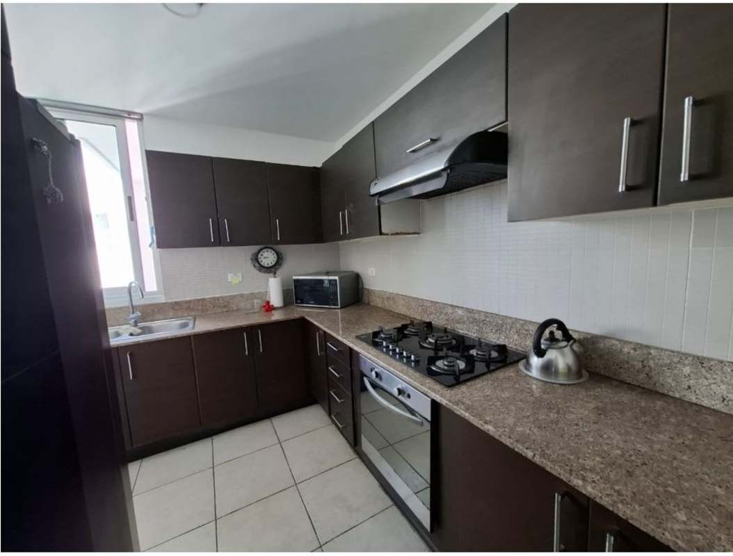 Modern kitchen with granite countertops, wood cabinetry, and appliances in PH Clayton Park I