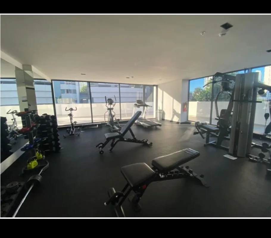Fully equipped gym with cardio and weights at PH Sky Swiss El Cangrejo Panama