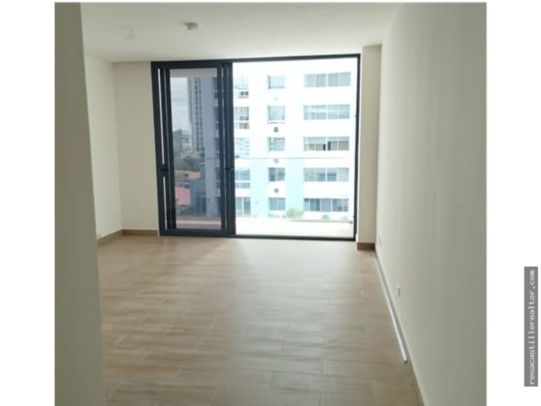 Living room with large windows city view in modern apartment PH Sky Swiss El Cangrejo Panama