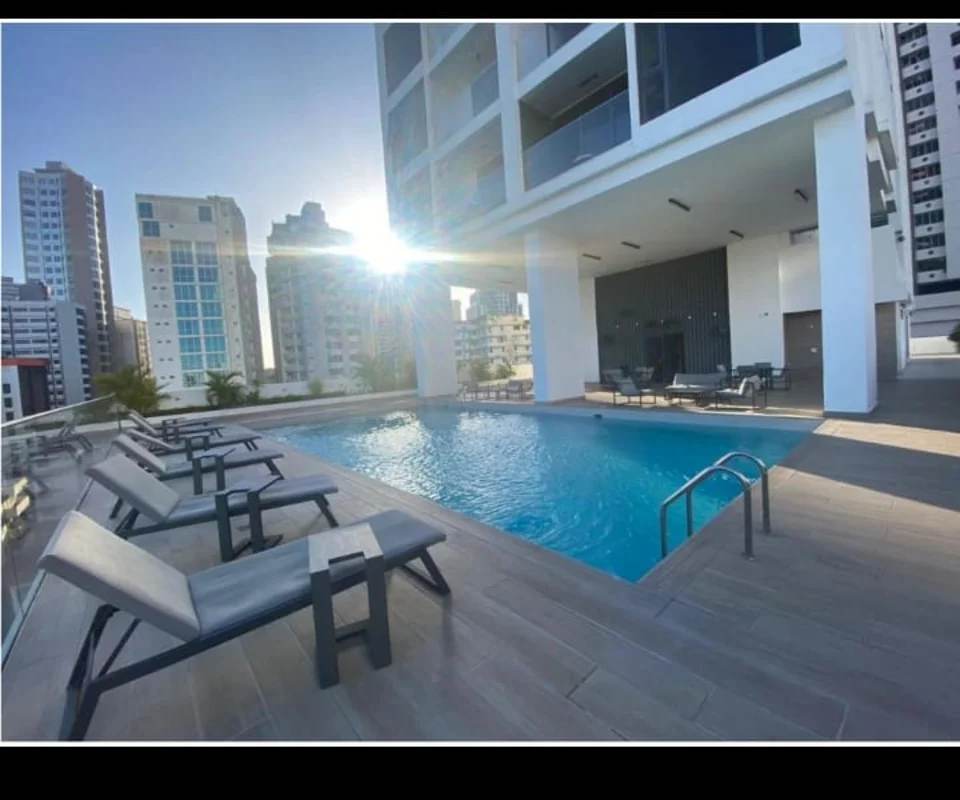 Modern rooftop terrace with swimming pool overlooking Panama City skyline at PH Sky Swiss El Cangrejo