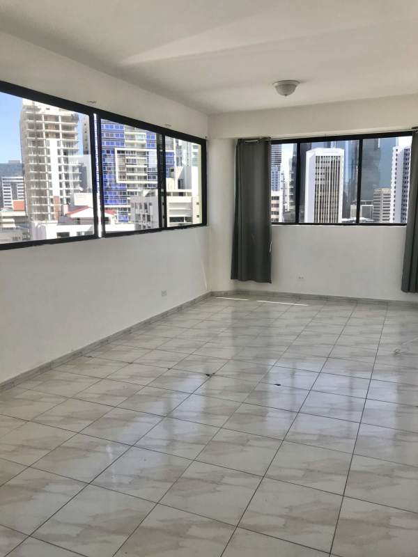 Spacious living room with ceramic tile floor, big window with city views in PH Royal Center Marbella