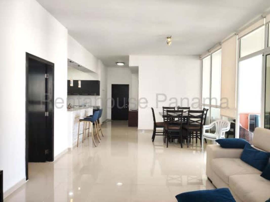 Modern kitchen with granite countertops and stainless steel appliances in PH Quadrat Panama City