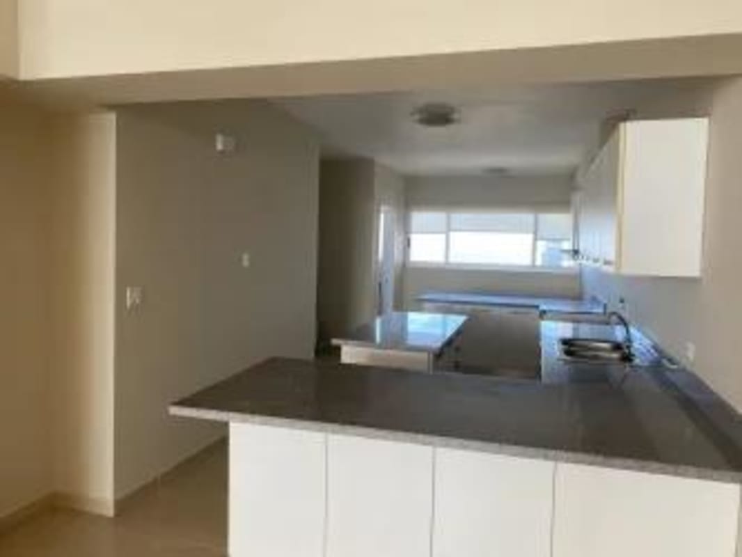 Large living space with panoramic windows and city views in PH Yoo Panama