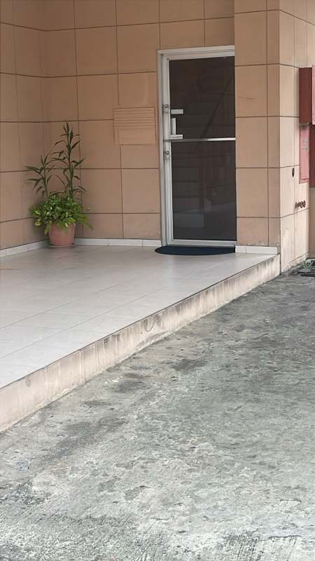 Multiple balconies with AC units and red awnings at PH Lefevre Residence Parque Lefevre Panama