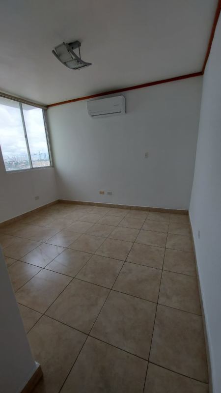 Contemporary kitchen with wooden cabinets and granite-style counters in Green Park Towers Panama