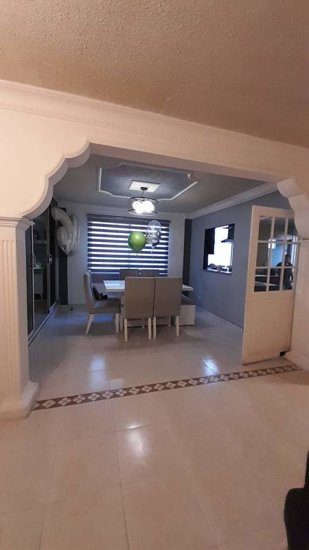 Bright living room with accent fireplace and modern furniture in house for sale Hato Pintado Panama