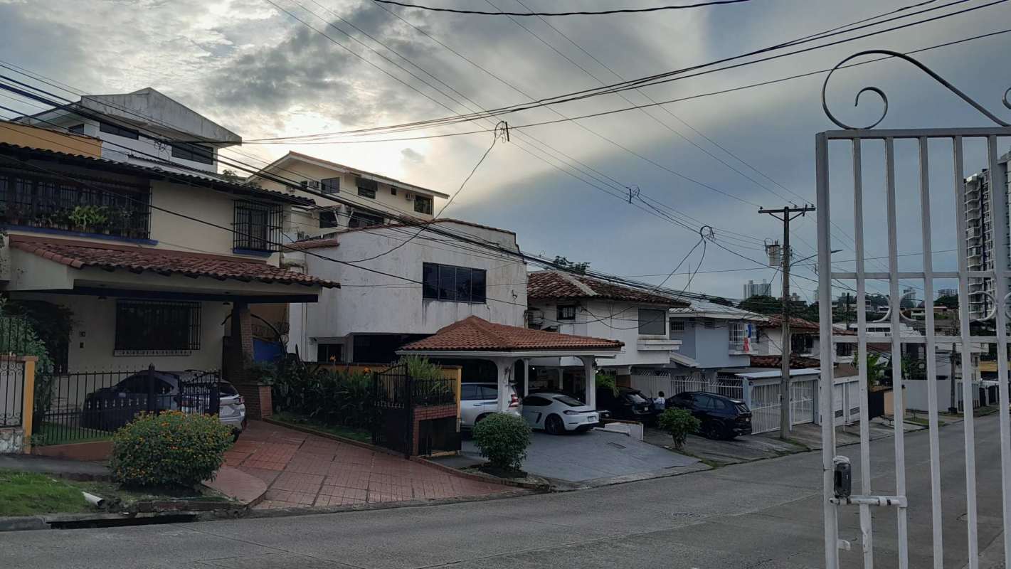 Spacious hallway and white staircase inside detached house in Hato Pintado Panama City
