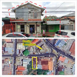 Street view of two-story commercial retail building with storefronts in downtown David Panama