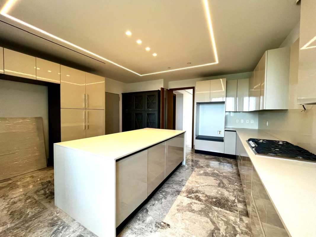 Modern bedroom with panoramic windows overlooking golf course The Reserve Santa María