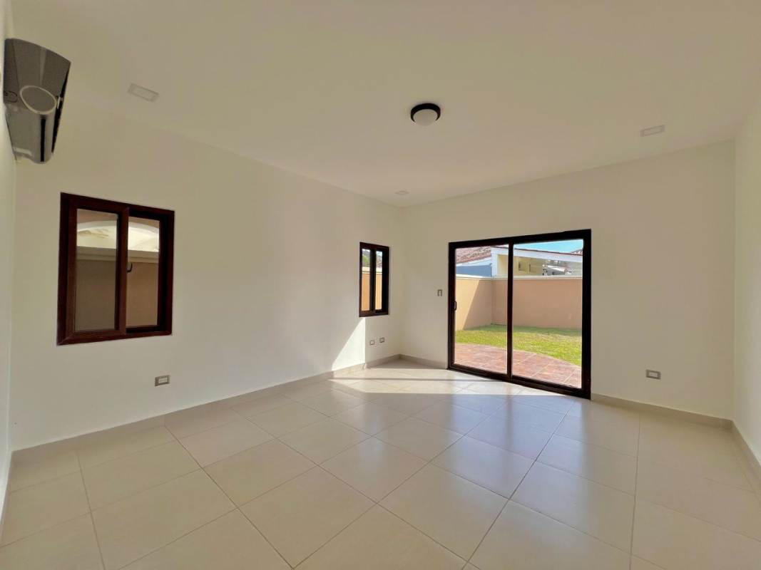 Contemporary kitchen with granite countertops and built-in stove Costa Sur Residences