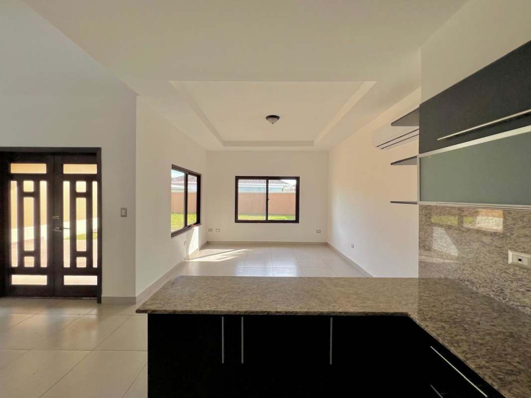 Living area with ceramic tile flooring open concept design Costa Sur