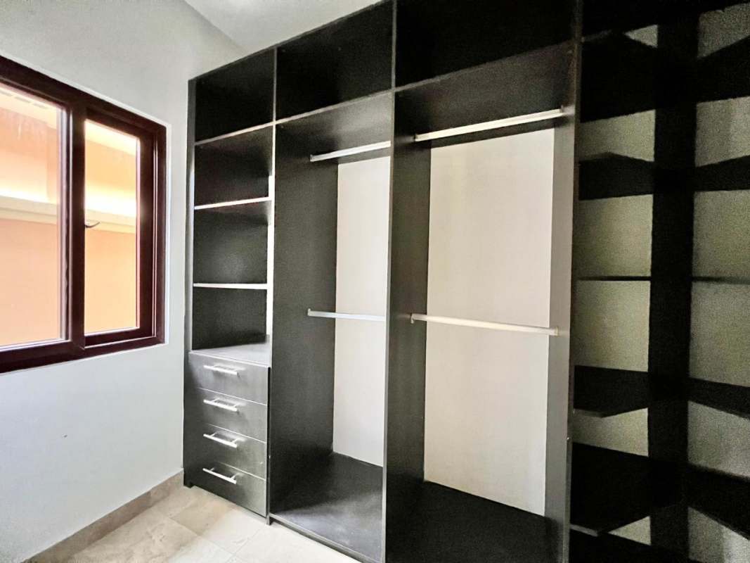 Spacious walk-in closet with custom shelving Costa Sur Panama City