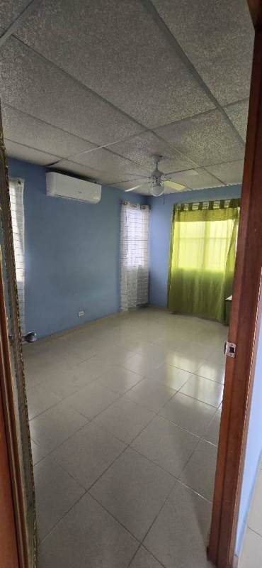 Bedroom area with split AC, closet, ceiling fan in affordable studio El Carmen Panama City