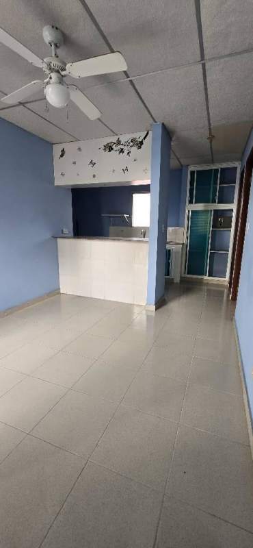 Compact kitchenette with granite breakfast bar, shelving in studio apartment El Carmen Bella Vista Panama