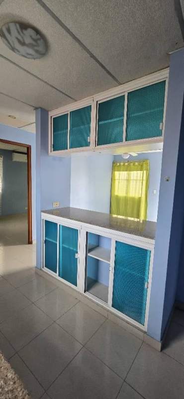 Bedroom with sliding closet doors, access to balcony in studio El Carmen Panama